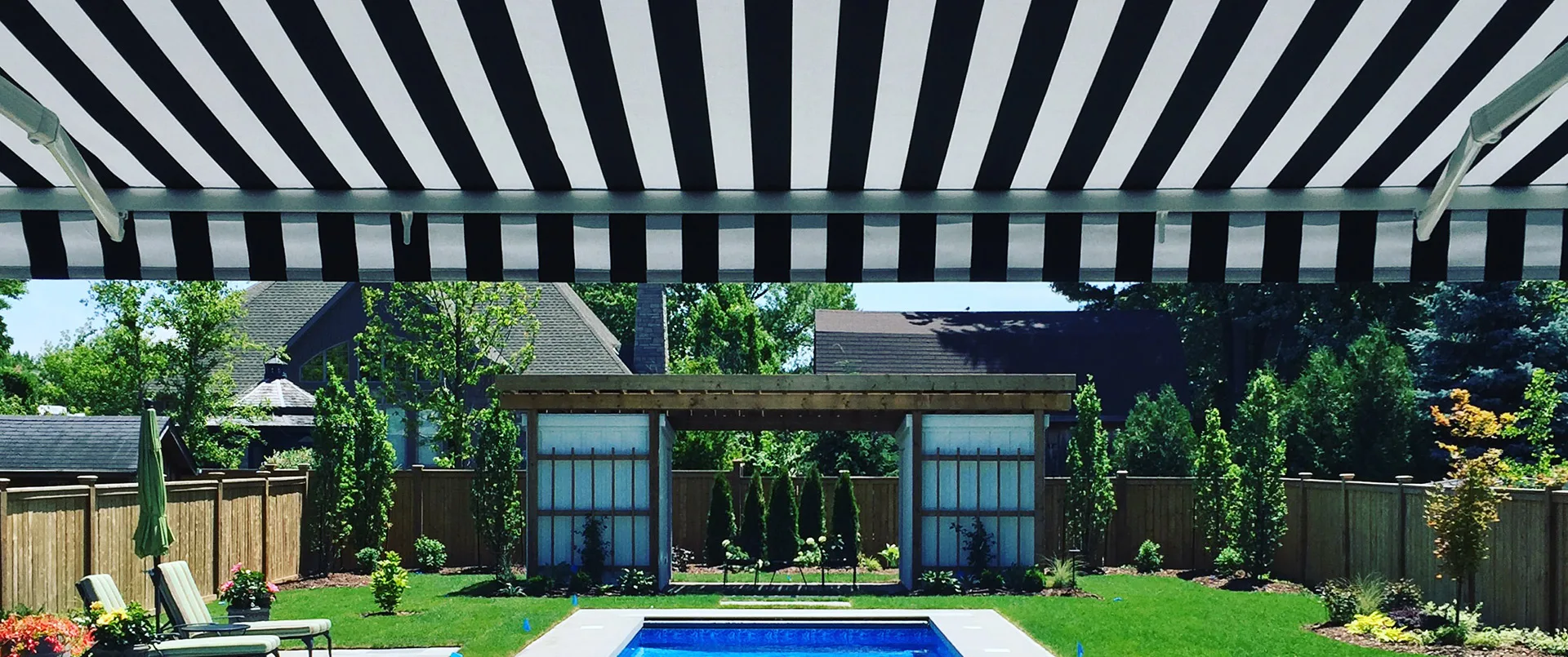 Retractable Awning Shade Area Overlooking Beautiful Backyard